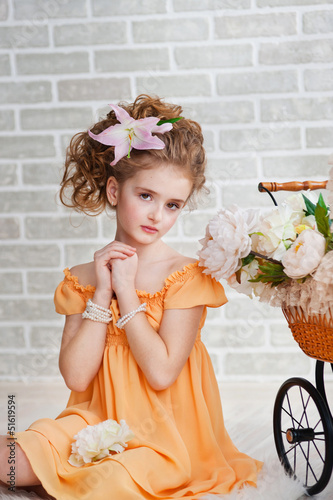 Photo: Girl in orange dress with vintage pram Girl in orange dress with vintage pram