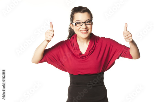 Photo: smiling dark-haired girl with blue eyes and glasses shows thumbs smiling dark-haired girl with blue eyes and glasses shows thumbs