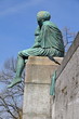 Sitting Helvetia statue on the river Rhine in Basel, Switzerland