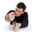 Photo: The man in handcuffs shows a fig. The man in handcuffs shows a fig.