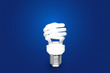 Compact Fluorescent Bulb on blue background