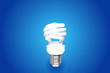 Compact Fluorescent Bulb on blue background