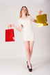 Photo: Funny blond woman with shopping bags Funny blond woman with shopping bags
