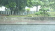 Heavy rain falling down on city street.