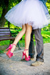 Legs of the groom and the bride.