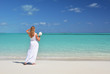 Girl with a shell in the hand on the beach of Exuma, Bahamas
