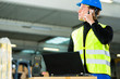 Worker with scanner and laptop at forwarding