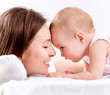 Mother and Baby kissing and hugging. Happy Family