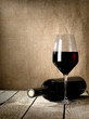 Black bottle of wine and wneglass