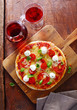 Colourful Italian tricolor pizza with red wine