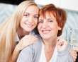 Woman with daughter on kitchen