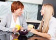 Woman with daughter on kitchen