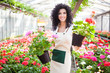 Woman holding flower pots
