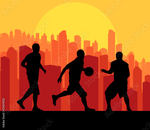 Vector: Basketball players in front of city sunset vector background Basketball players in front of city sunset vector background