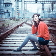 Beautiful stylish woman listening to music