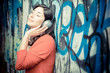 Beautiful stylish woman listening to music