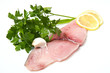 swordfish with lemon and parsley on white
