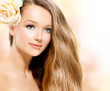 Beauty Girl. Beautiful Model with Rose Flower