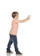 Photo: Boy pushing something Boy pushing something