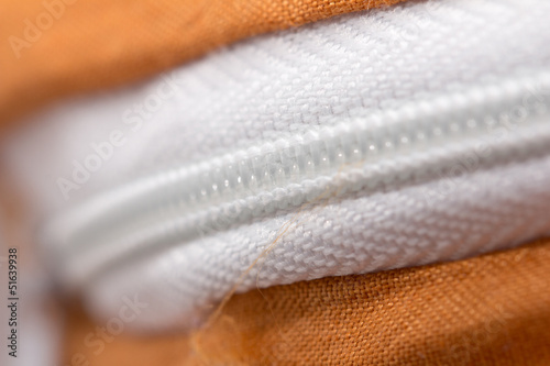 Photo: lock on white fabric. macro lock on white fabric. macro