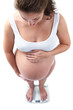 pregnant woman on scale