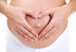pregnant belly with fingers heart symbol