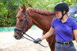young woman rider and horse