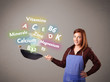 Young woman cooking vitamins and minerals