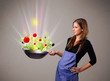 Young woman cooking fresh vegetables