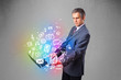 Businessman holding notebook with colorful hand drawn multimedia