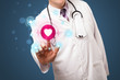Middle aged doctor pressing modern medical type of button