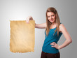 Young girl presenting old paper copy space
