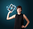young woman holding tablet with social network icons