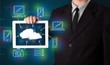 Photo: Businessman showing hand drawn cloud computing Businessman showing hand drawn cloud computing