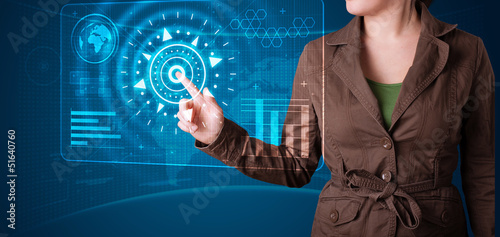 Photo: Woman pressing high tech type of modern buttons Woman pressing high tech type of modern buttons