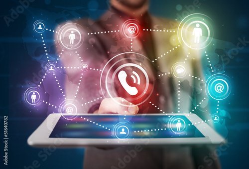 Photo: Businessman showing social networking technology with colorful l Businessman showing social networking technology with colorful l