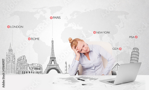 Photo: Beautiful businesswoman with world map and major landmarks of th Beautiful businesswoman with world map and major landmarks of th