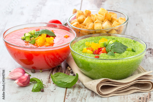 Photo: Delicious cold red and green gazpacho soup with garlic croutons Delicious cold red and green gazpacho soup with garlic croutons