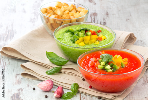 Photo: Delicious cold red and green gazpacho soup with garlic croutons Delicious cold red and green gazpacho soup with garlic croutons