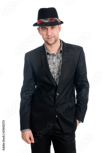 Photo: Handsome man in a hat on a white background Handsome man in a hat on a white background