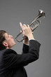 Portrait of a young man playing his Trumpet