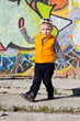 Adorable little boy striking a dance pose