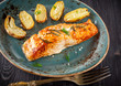 Grilled salmon and roasted potatoes with herbs