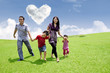 Asian family running in the park