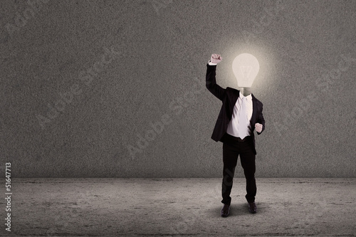 Photo: Successful businessman with lightbulb head Successful businessman with lightbulb head