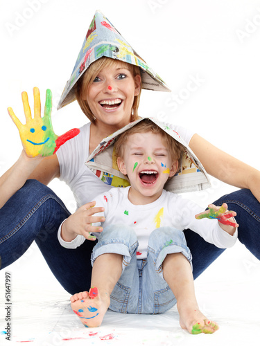 Photo: Cute boy and mother have coloured hands, playing together Cute boy and mother have coloured hands, playing together