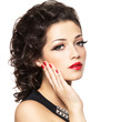Beautiul fashion model with red manicure and lips