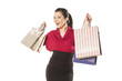 happy and smiling blue-eyed brunette holding shopping bags