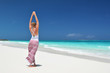 Girl on the desrt beach of Little Exuma, Bahamas
