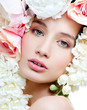 fashion model with large hairstyle and flowers in her hair.
